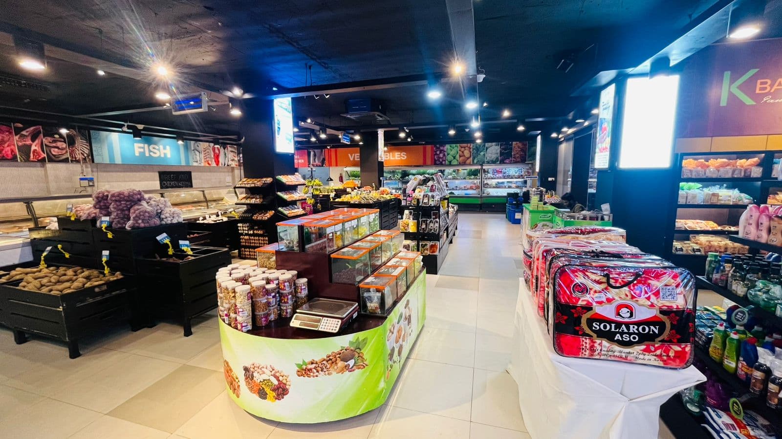 The Khulshi Mart shop floor, with produce and dry goods on display