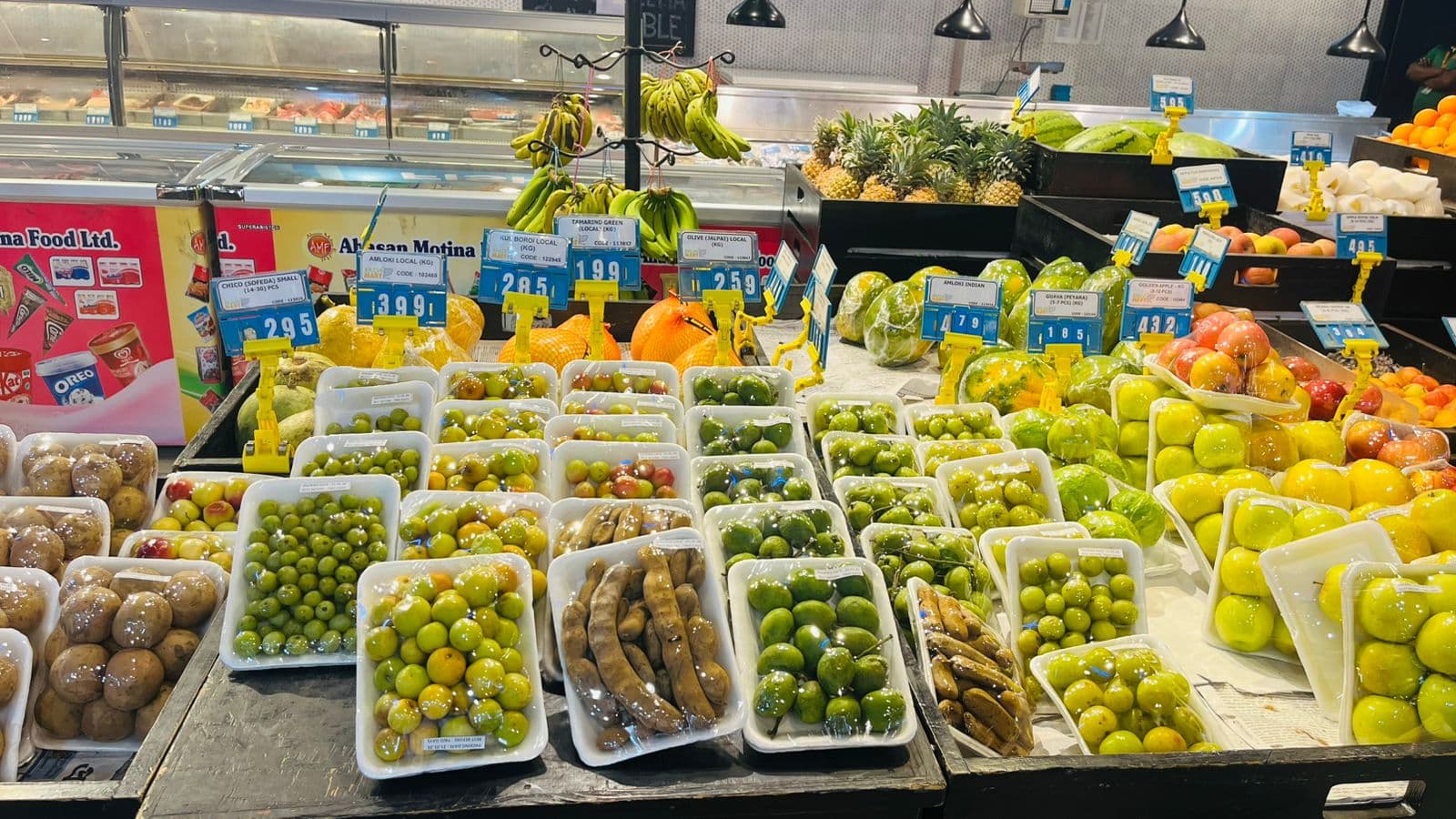 Packed local fruit on display at Khulshi Mart